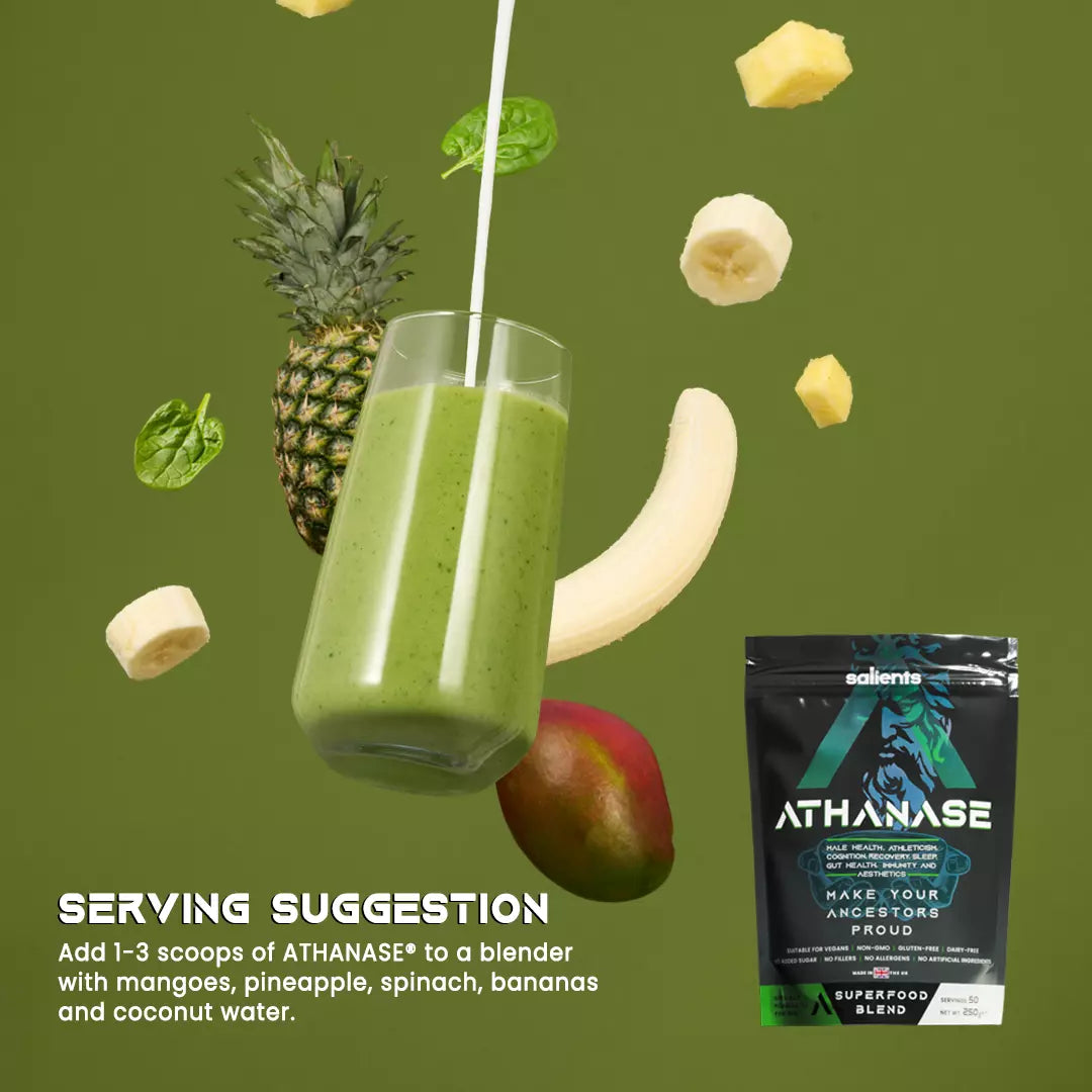 Green smoothie with pineapple, banana, and mango on a green background with Athanase superfood blend packaging.