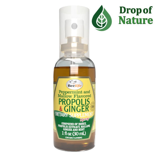 Bottle of BeeLife Propolis & Ginger dietary supplement with 'Drop of Nature' logo on a white background