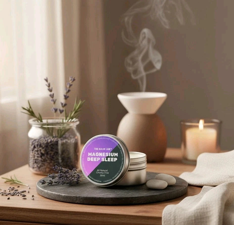 Magnesium deep sleep product on a wooden surface with lavender and a diffuser in the background