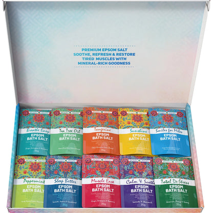 Box of various Epson bath salt packages with colorful labels.