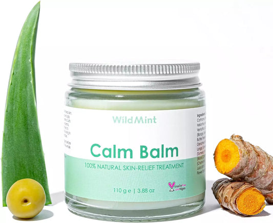 Jar of Wild Mint Calm Balm with aloe vera leaf, lemon, and turmeric root on a white background